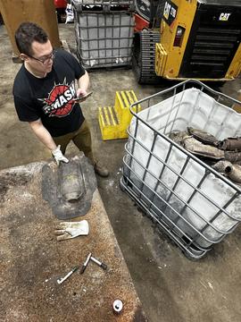 SMASH Scrap | Employee Sorting Catalytic Converters for Recycling