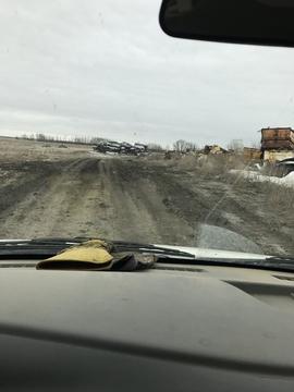 Exploring a Scrap Metal Yard: A View from Inside a Vehicle