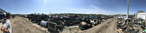 Expansive View of Scrap Metal Recycling Yard with Various Materials