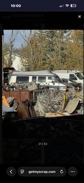 Efficient Scrap Metal Recycling Yard with Vehicles and Metal Piles